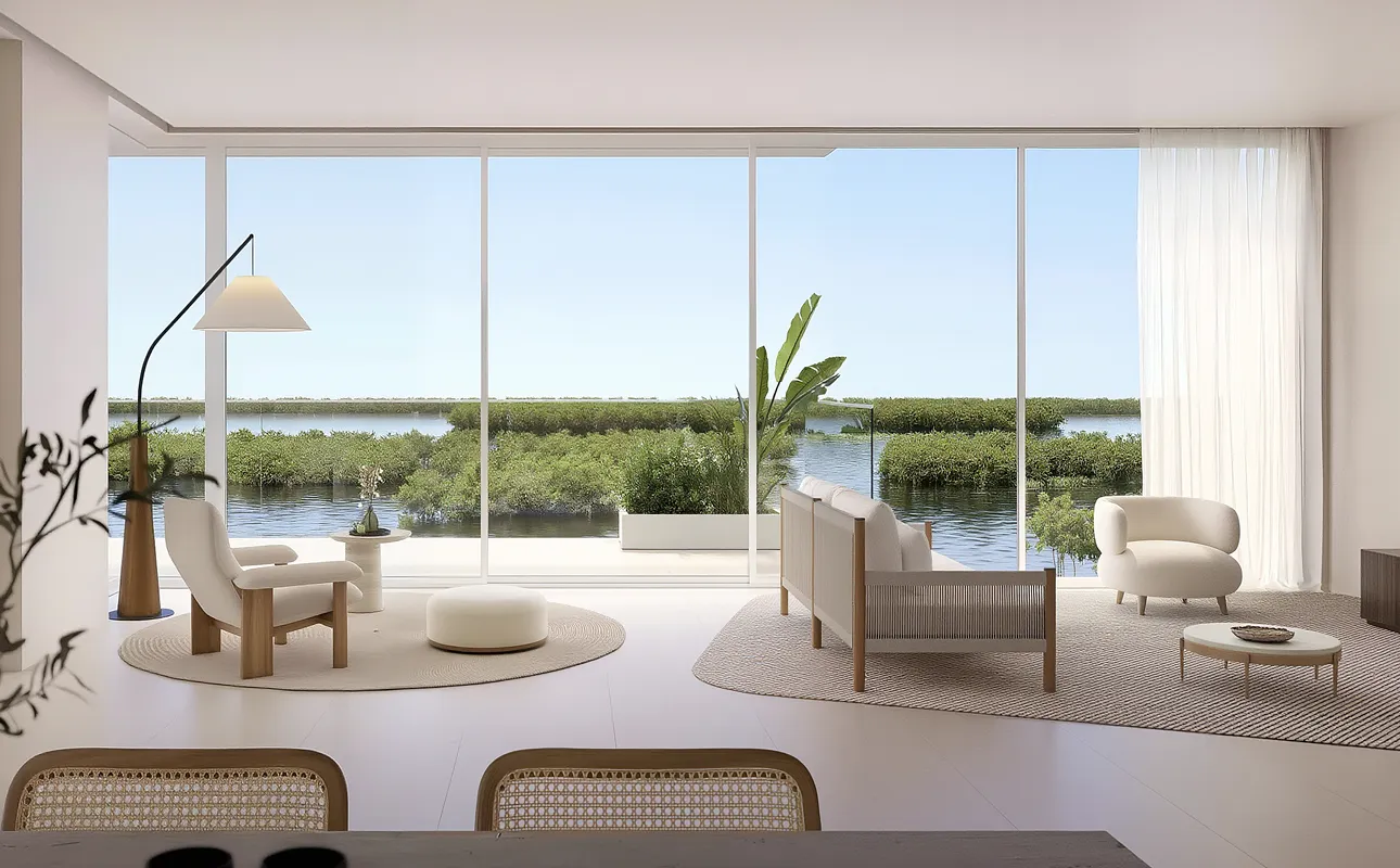Open-plan living area overlooking the waterfront and mangroves at Creekside Residence
