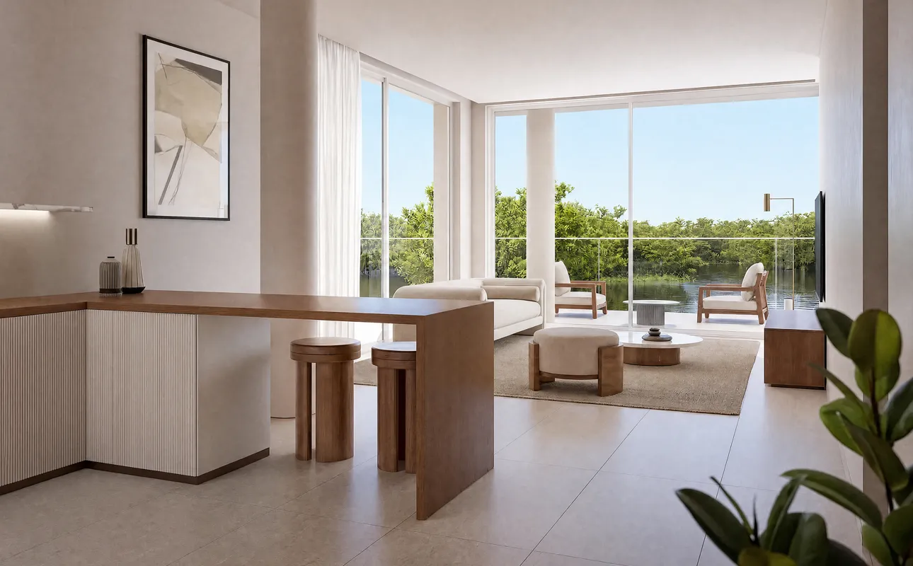 Open-plan kitchen and living room with waterfront views at Creekside Residence